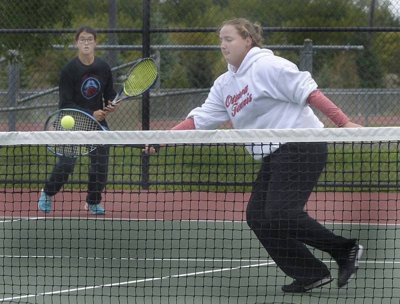 Ottawa’s Mackenzie Eichelkraut and Zulu Moreland compete during doubles play Saturday at the Class 1A La Salle-Peru Sectional.