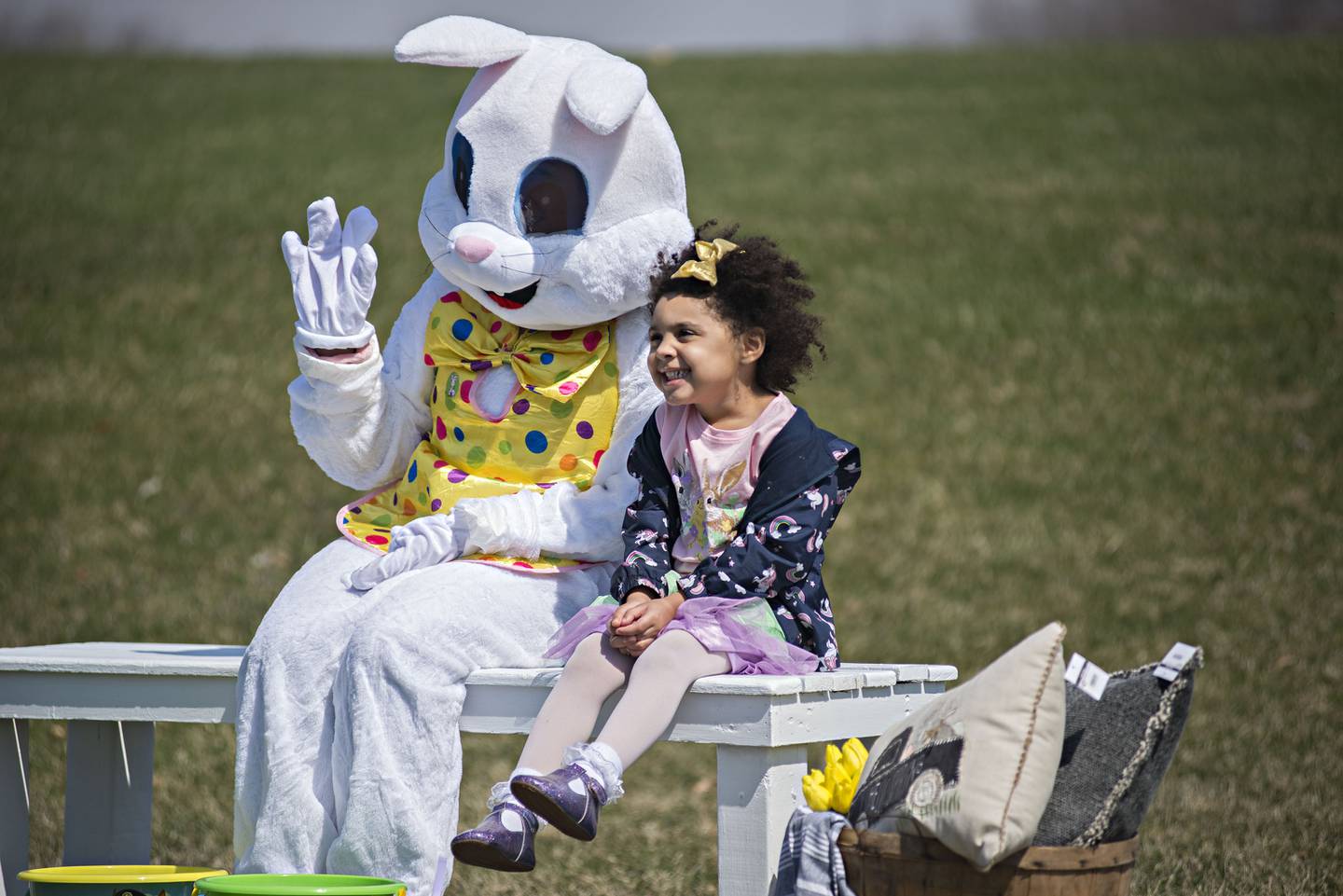 In a file photo from April 3, 2021, Mickinzy Sandoval, 4, smiles big while having her picture taken with the Easter Bunny Saturday in Dixon. Families who signed up for the Dixon Park District event picked a time to scramble for eggs, play some games and have some treats.