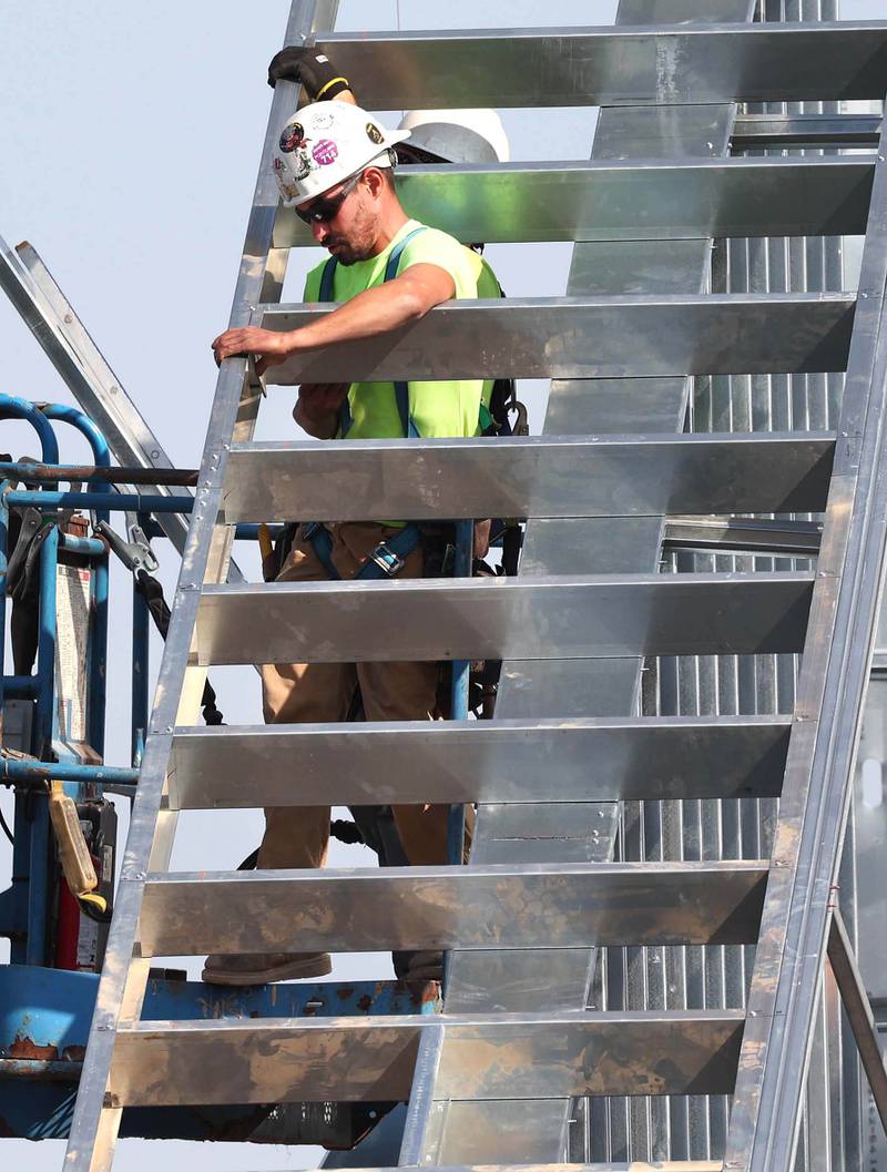 Irving Construction employees work on the roof of the new DeKalb fire station Wednesday, Sept. 18, 2024, at 1130 South Malta Road in DeKalb. Construction on the station, the fourth for the DeKalb Fire Department, is ongoing.