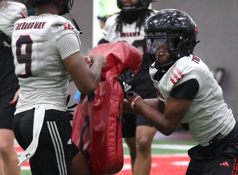 Northern Illinois’  Jacob Finley (right) participates in a drill Wednesday, July 30, 2025, in the Chessick Practice Center at NIU in DeKalb.