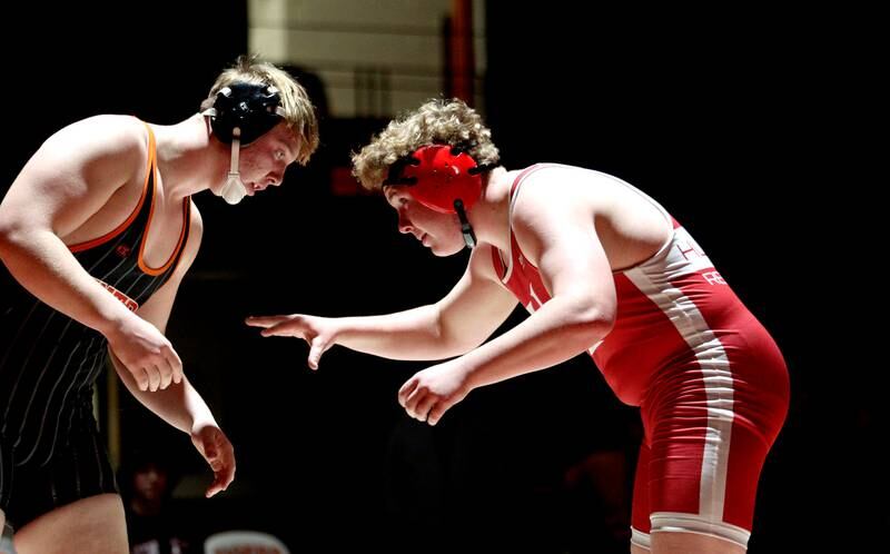 Crystal Lake Central’s Tommy McNeil, left, battles Huntley’s Dylan Cerny in a 215-pound bout in varsity wrestling at Crystal Lake Friday.  McNeil won the match.