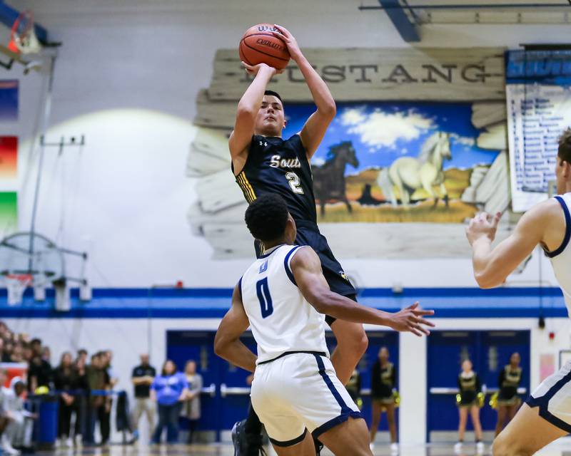 Hinsdale South's Jack Weigus (2) shoots a jumper during basketball game between Hinsdale South at Downers Grove South. Dec 1, 2023.