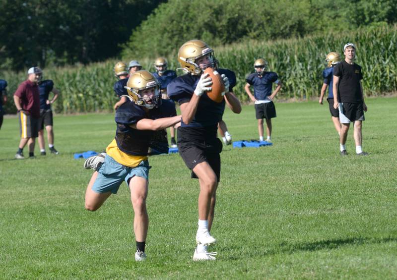 A Polo High School player catches a pass during practice on Wednesday, Aug. 13, 2025, in Polo.
