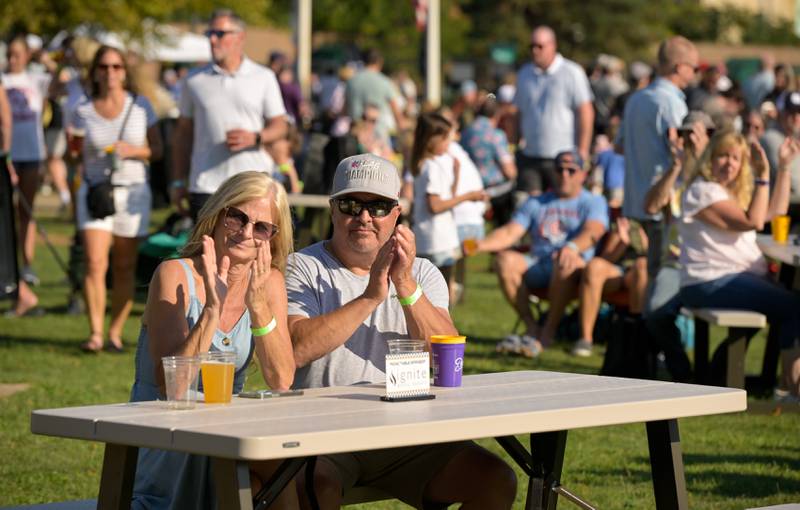 Amy and Mike Custer applaud for Cheryl Rodey as she finishes her set at the Batavia MainStreet’s Block Party & Taste of Batavia on Sunday, Aug 31, 2025 in Batavia.