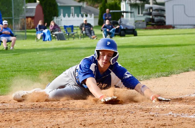 Princeton's Will Lott slides in to home for a Tiger run in Monday's game against Hall. The Red Devils won 10-4.
