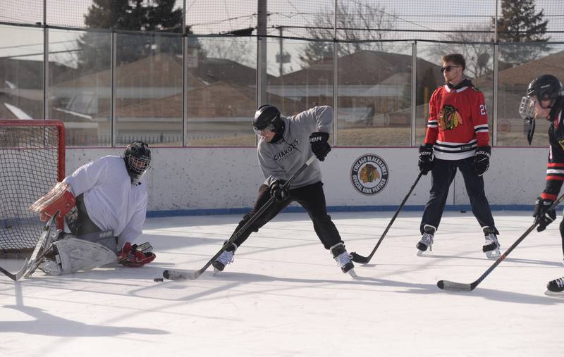 People including (left-right) Jeremiah Smith of Chicago, Zach Johnson of Chicago, Alan Zasavny of Burbank and Edward Plonis of Oak Lawn participate in Stick & Puck at the Bobby Hull Community Ice Rink Sunday, Jan. 26, 2025 in Cicero.