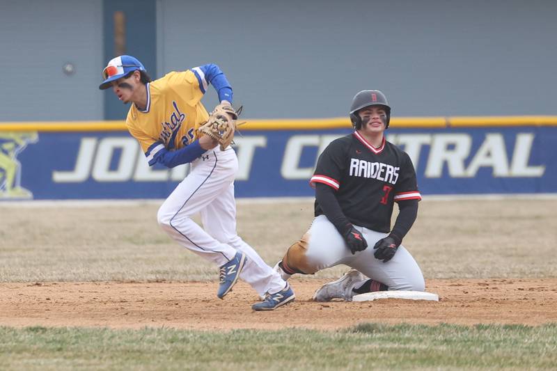 Bolingbrook’s Tommy Corley sits at second as Joliet Central’s Nathan Maldonado heads to the dugout after completing a double play on Tuesday, March 21st. 2023.
