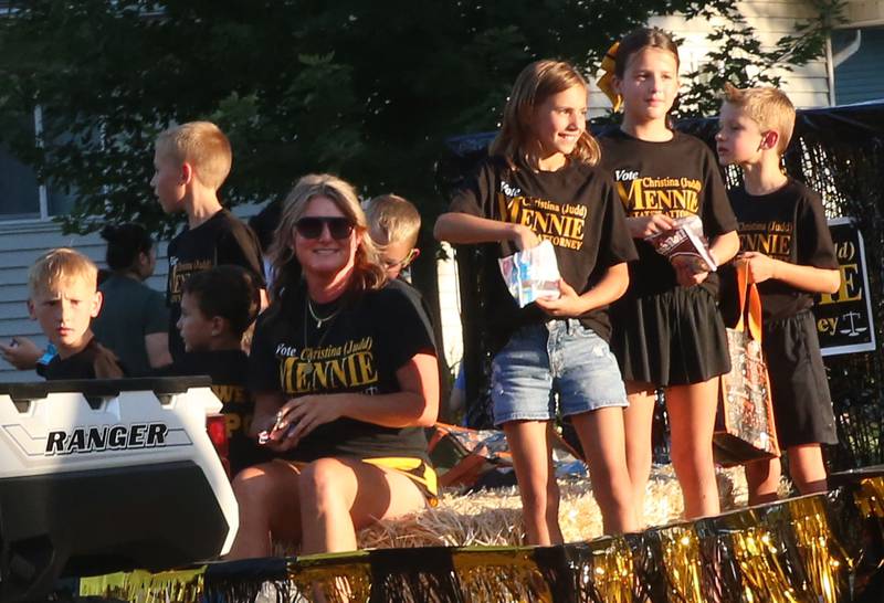 Putnam County States Attorney Christina Judd Mennie rides on a float with children during the inaugural Homecoming parade on Wednesday, Sept. 17, 2025 down Elm Street in Granville.