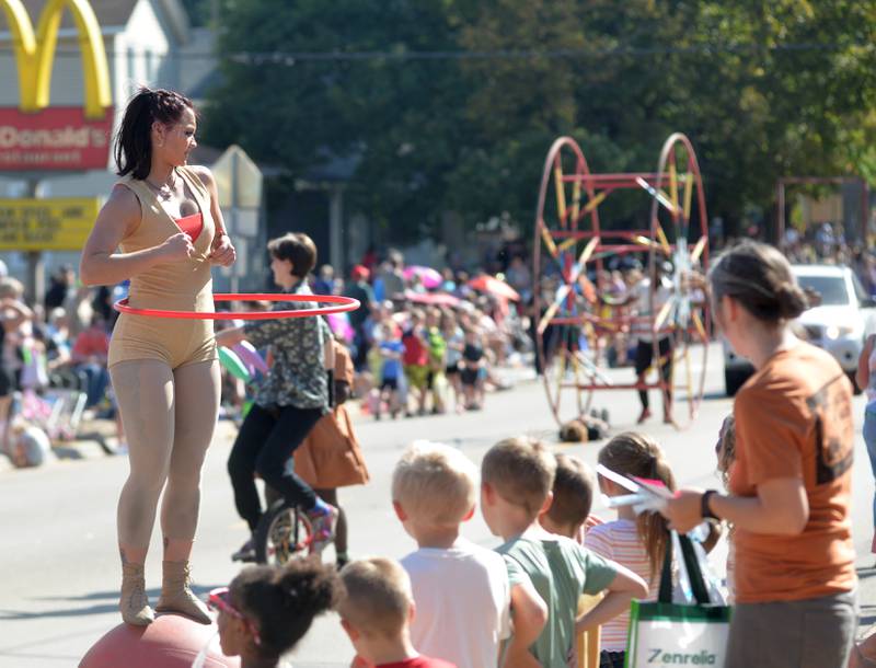 Paid performers show their acrobatic skills during the Harvest Time Parade at Autumn on Parade on Sunday, Oct. 5, 2025 in Oregon.