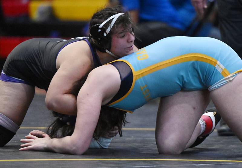 Hampshire’s Anneliese Tavira, left, wrestles Maine West’s Lillian Garrett in the 170-pound final during the Schaumburg girls wrestling sectional Saturday.