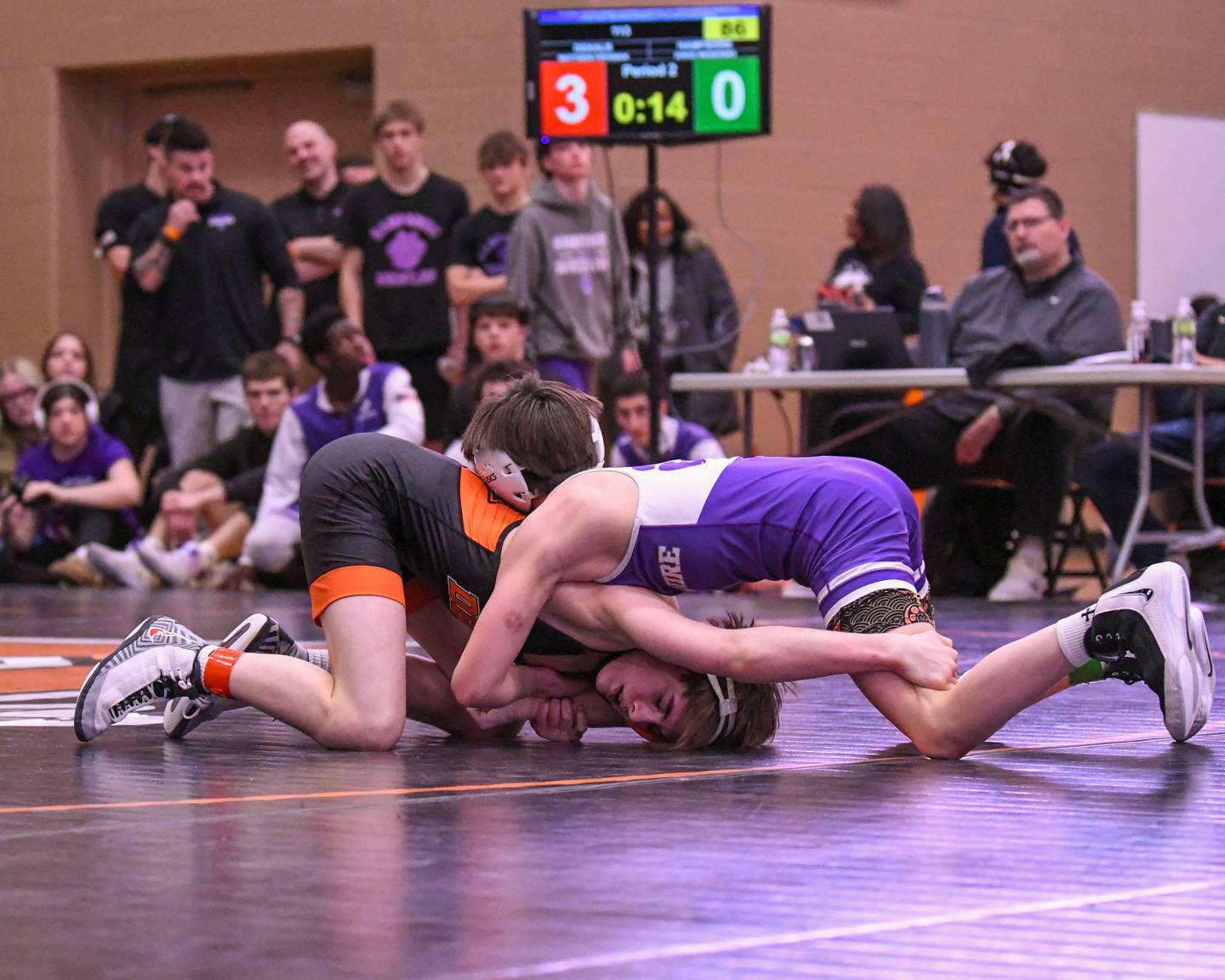 Matthew Frykman of DeKalb, left, wrestles David Wesierski of Hampshire during the 113-weight class of the regional 3rd place match on Saturday Jan. 31, 2026, held at DeKalb High School.