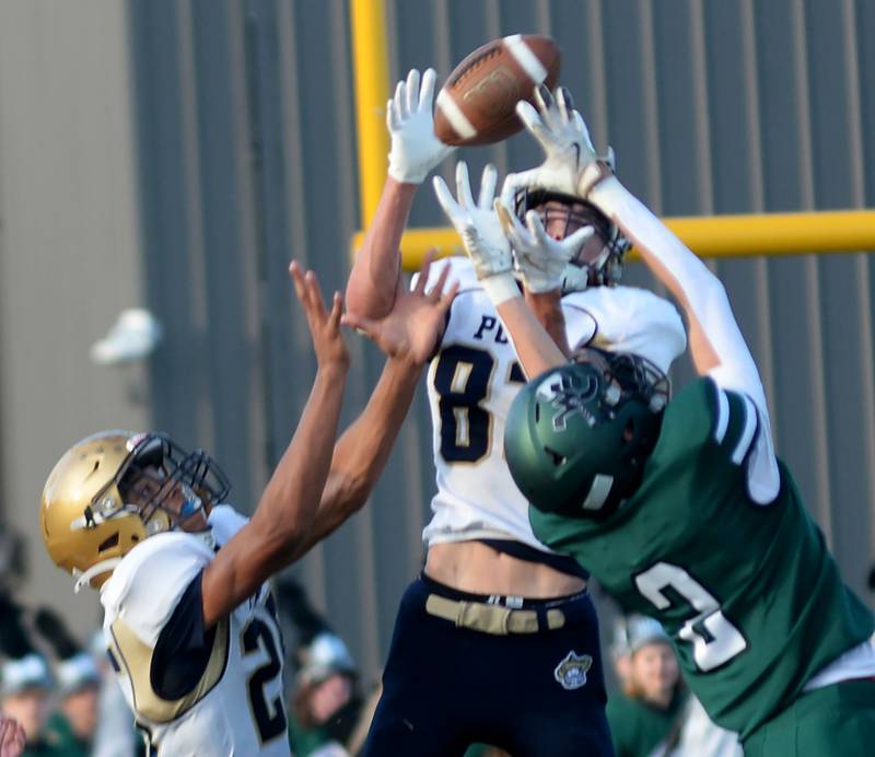 Polo's Mercer Mumford (83) reaches for the ball as he intercepts a pass to West Carroll's Ryker Budimlija (2) in 8-man football action in Mt. Carroll on Friday, Sept. 12, 2025.