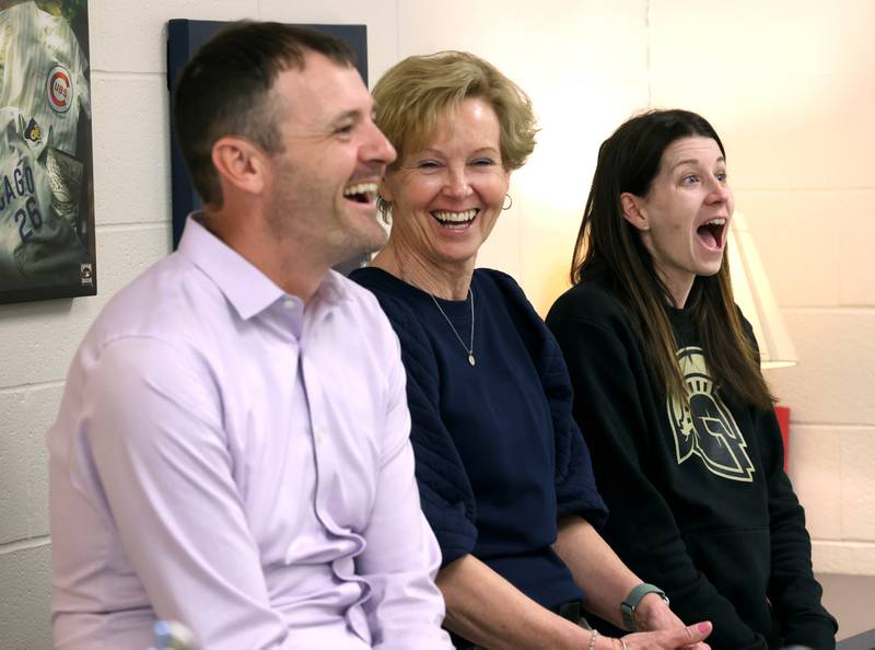 Dan Wheeler, (left) a fifth grade teacher, Deb Wheeler, a paraprofessional, and 	
Whitney Wheeler, (right) a third grade teacher,  who all work at South Prairie Elementary School in Sycamore, have a laugh as they talk Friday, April, 11, 2025, at the school, about the benefits and enjoyment that comes from working together in the same building.