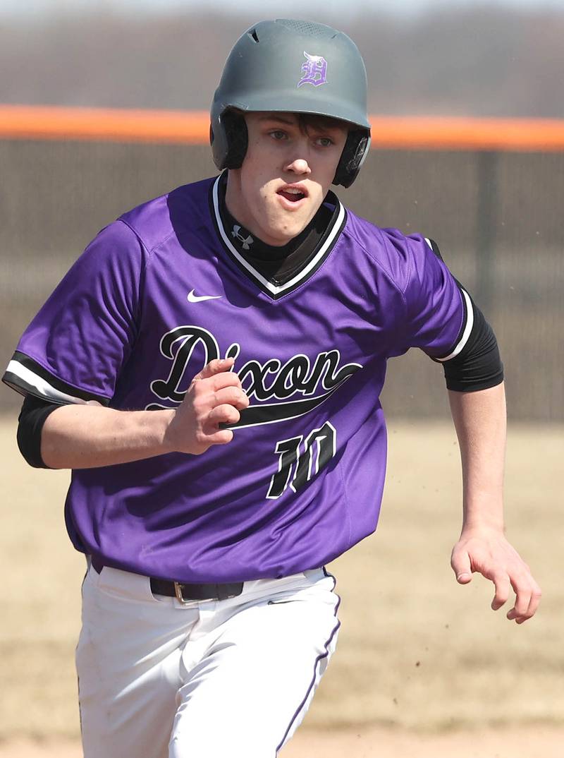 Dixon’s Bryce Feit runs to third during their game against DeKalb Tuesday, March 28, 2023, at DeKalb High School.