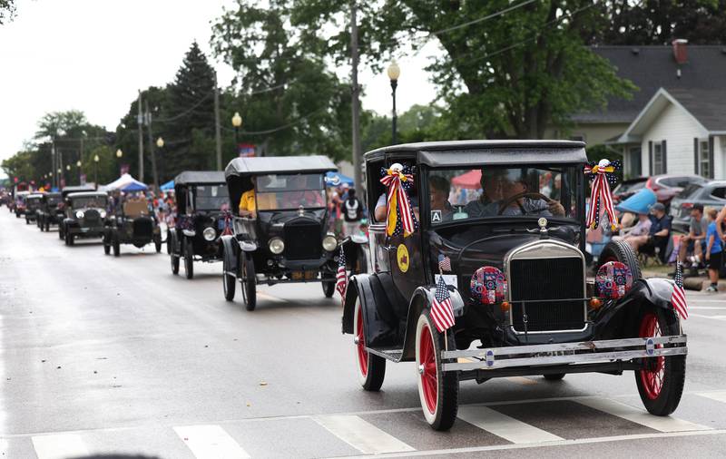 Antique cars make their way down Main Street Friday, July 4, 2025, during the Fourth of July parade in downtown Kirkland.