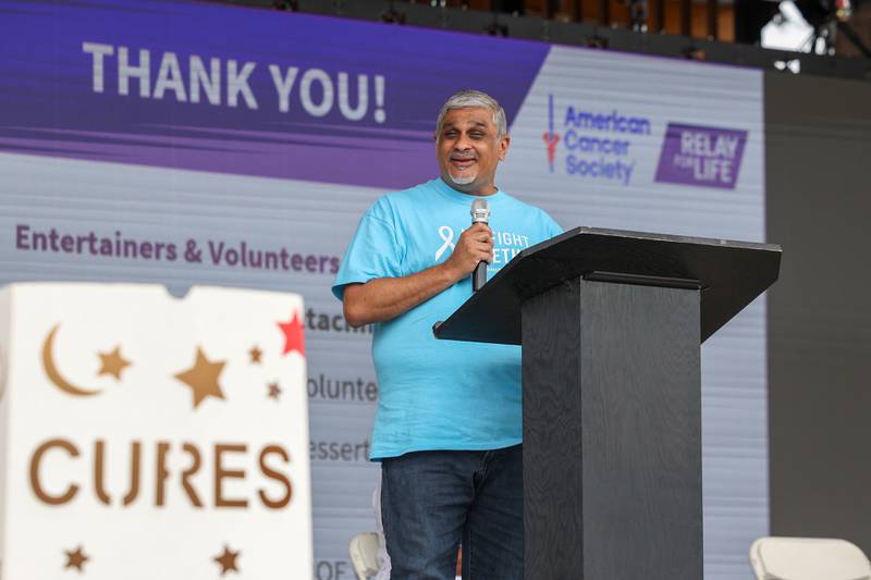 Riverside's Dr. Ahsan Basha speaks during the opening ceremony for the Relay for Life of Kankakee County, presented by Riverside Cancer Institute, on June 14, 2025, at The Grove in Bourbonnais.