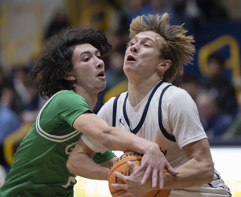 Sterling’s Aidan Lacy is fouled by Geneseo’s Dylan Haser Friday, Dec. 5, 2025.