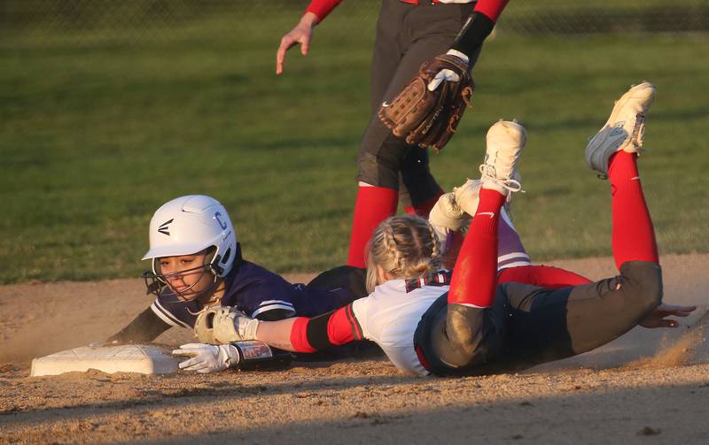 Plano's Maddy Leftridge is tagged out by Ottawa's Ryleigh Stehl while sliding into second base on Thursday, April 6, 2023 at King Field in Ottawa.