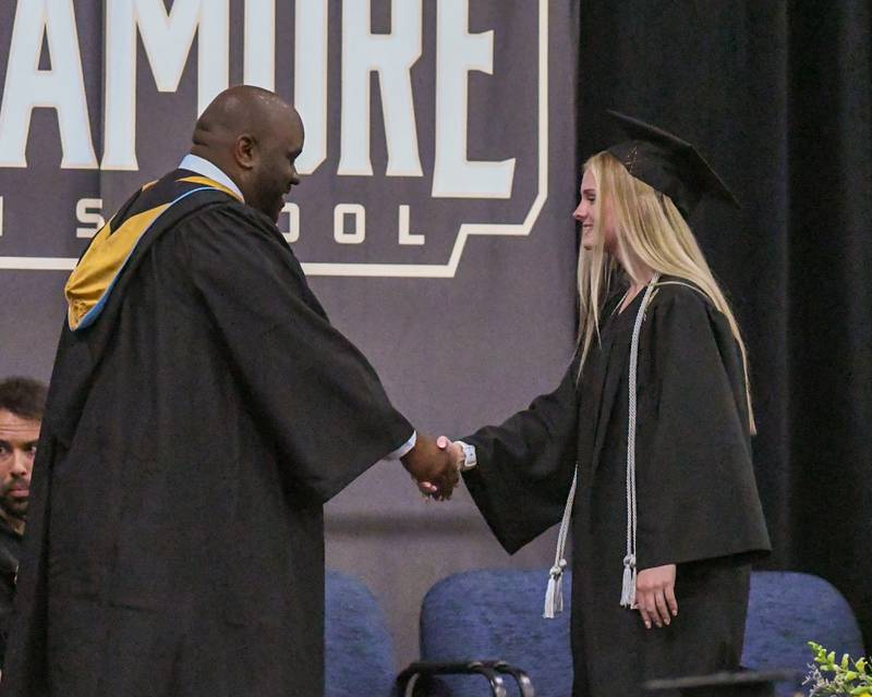 A Sycamore graduate is all smiles as she receives her diploma on Sunday May 24, 2026, during the graduation ceremony held at Sycamore High School.