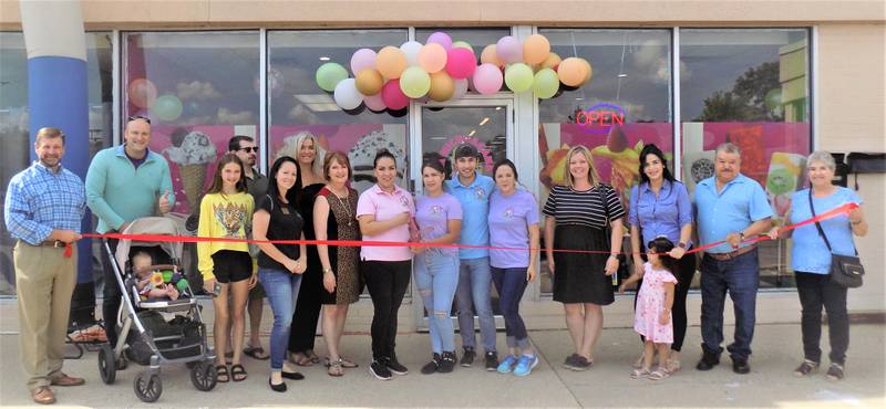 Owners of La Michoacana Twister, Maria, Carlos, Alejandro and Guadalupe Rodriguez are joined by friends, family, staff and members of the Cary-Grove Area Chamber of Commerce to celebrate their Grand Opening.