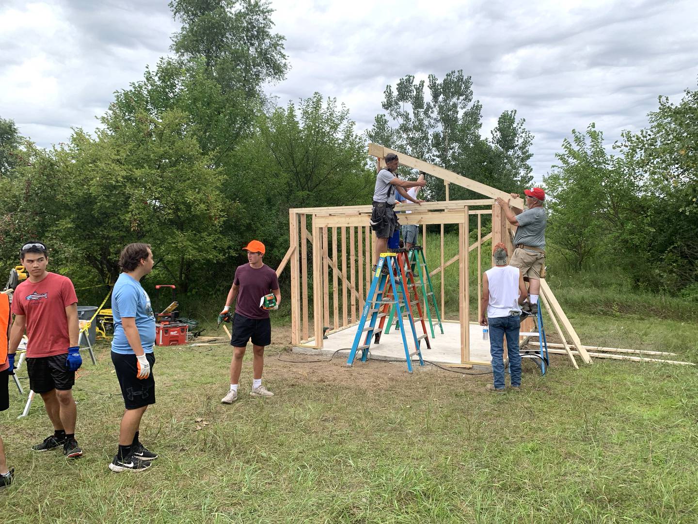 Volunteers work with Sugar Grove resident Christopher Eby to replace a dilapidated shed for the Sugar Grove United Methodist Church (SGUMC). The project was Eby’s his Eagle Project for Sugar Grove Boys Scouts of America Troop No. 41.