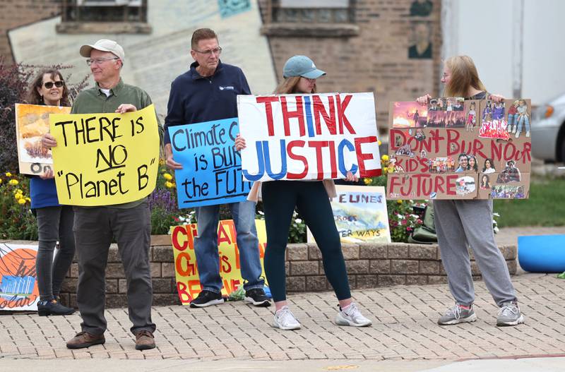 People gather for a rally Saturday, Sept. 16, 2023, at Memorial Park in downtown DeKalb. The demonstration was held to push legislators to promote alternative forms of energy and lessen the use of fossil fuels.