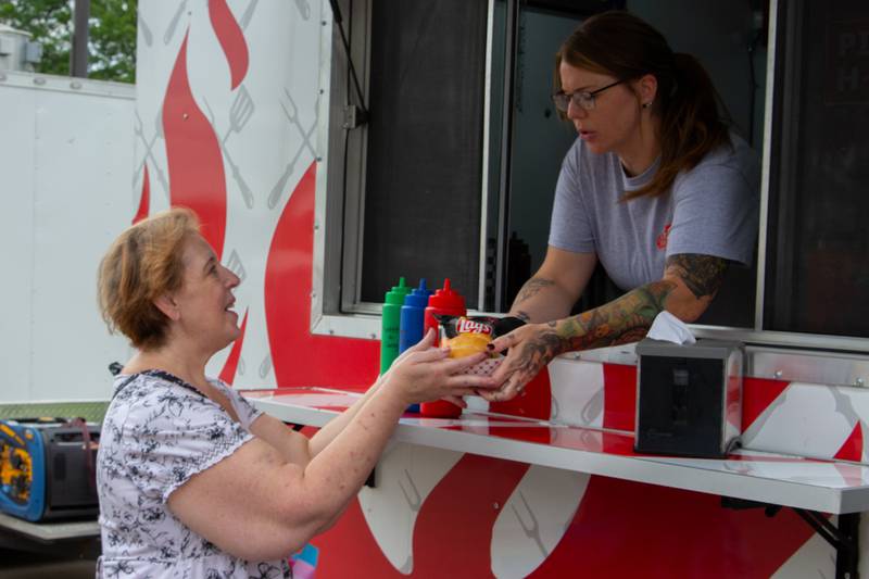 Lynn Keyt receives order from Tony’s Butt Shack on Saturday, June 8, 2024 at Jordan Block Park in Ottawa.