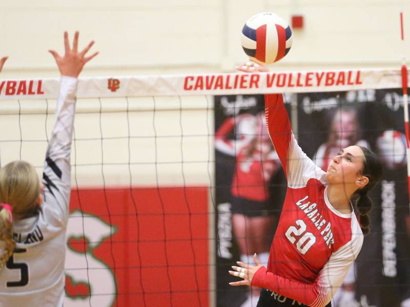 L-P's anna Riva sends a kill past Kaneland's Abigail Carter on Tuesday, Oct. 7, 2025 in Sellett Gymnasium at L-P High School.