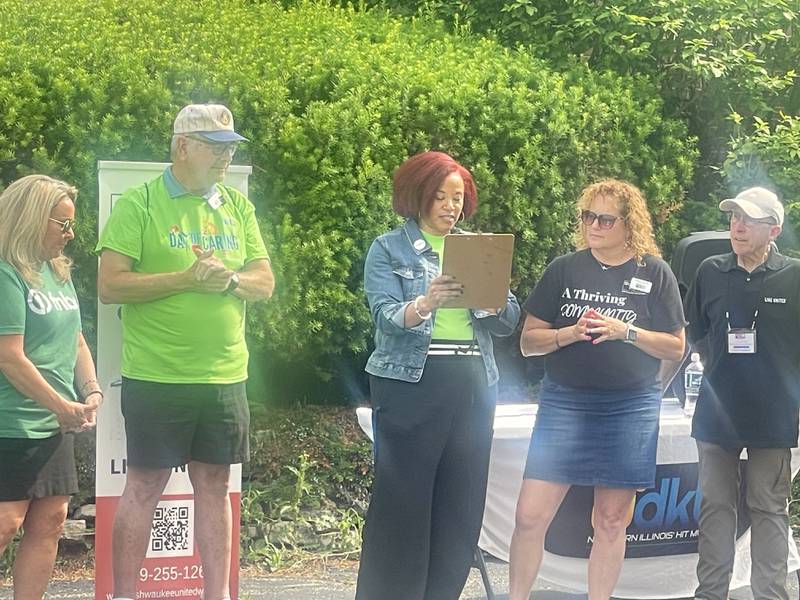 Kishwaukee United Way executive director Michele Vaughn (third from right) gives remarks on Thursday, June 12, 2025, at Kishwaukee United Way's annual Day of Caring in DeKalb.