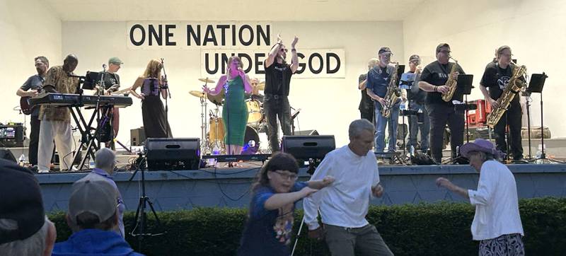People dance to the music of Brass From The Past at the Jamboree Concert Series on Friday, Aug. 1, 2025  in Mt. Morris.