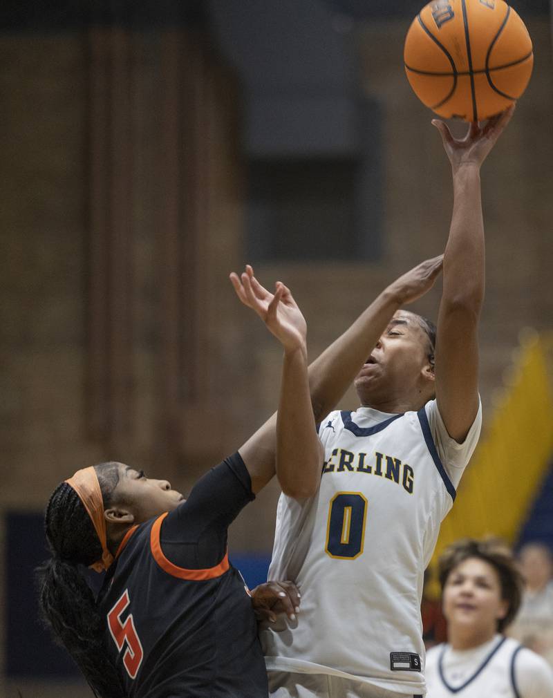 Sterling’s Alivia Gibson puts up a shot against United Township’s Reemaz Adam Thursday, Dec. 18, 2025.