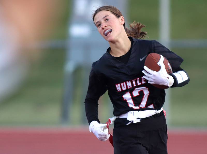 Huntley’s Aubrina Adamik cruises in the end zone with a touchdown against McHenry in varsity flag football at Huntley High School in Huntley on Tuesday, Sept. 9, 2025.
