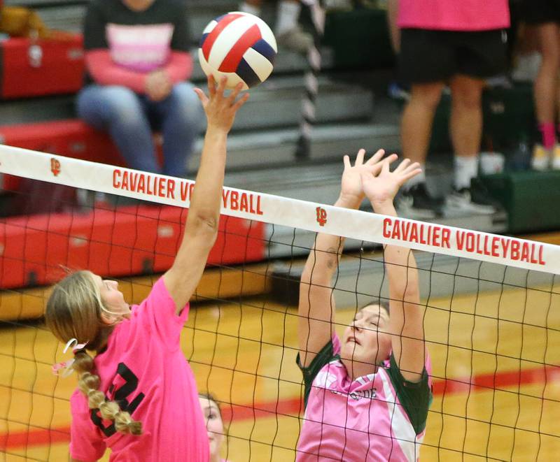 L-P's Kelsey Frederick spikes the ball past St. Bede's Bella PInter during the "Cavs 4 A Cause" pink night game on Tuesday, Sept. 26, 2023 at Sellett Gymnasium.