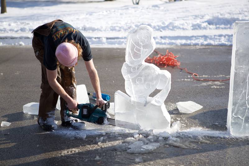 Ice carver making Olaf at Frozen Fest at Maryknoll Park on Saturday, Jan. 11, 2025 in Glen Ellyn.