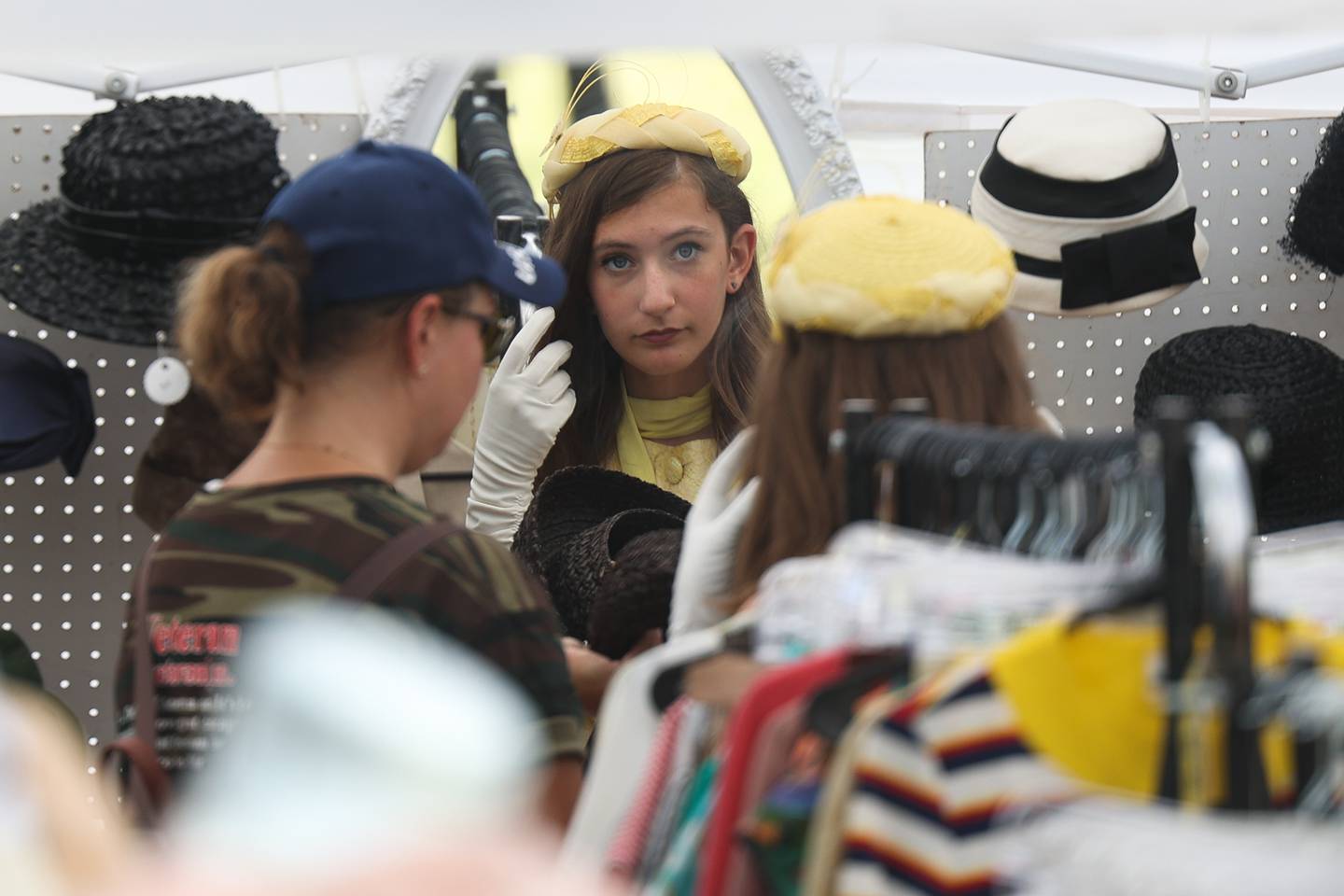 London Shoevlin found a yellow hat to go with her 1940’s outfit at one of the vintage apparel tents at Lockport Military History Days at Dellwood Park on Saturday, Sept. 9, 2023 in Lockport.