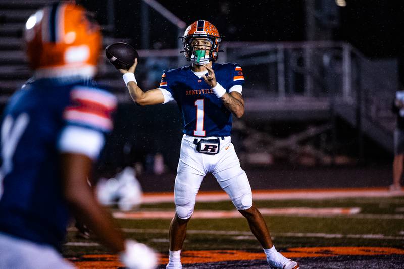 Romeoville's Richard Conley passes to Keilan Winfield during a game against Plainfiled North on Friday Sept. 19, 2025 at Romeoville High School