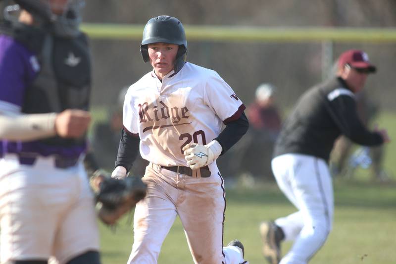 Prairie Ridge’s Connor Innis scores against Hampshire in varsity baseball on Wednesday, April 16, 2025, at Prairie Ridge High School in Crystal Lake.