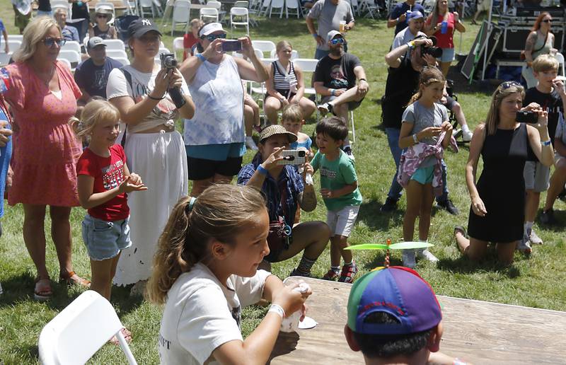Parents watch and take photographs as they kids take part in the ice cream eating contest during Lakeside Festival on Friday, July 5, 2024, at the Dole.