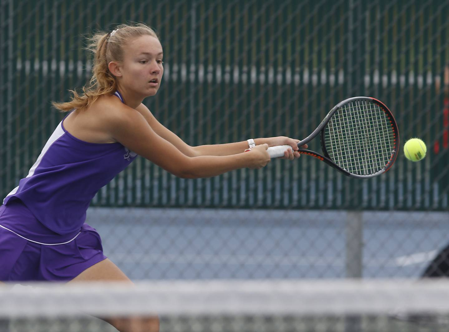 Dixon’s Grace Ferguson returns the ball Thursday, Oct. 19, 2023, during the first day of the IHSA State Girls Tennis Tournament at Hersey High School in Arlington Heights.