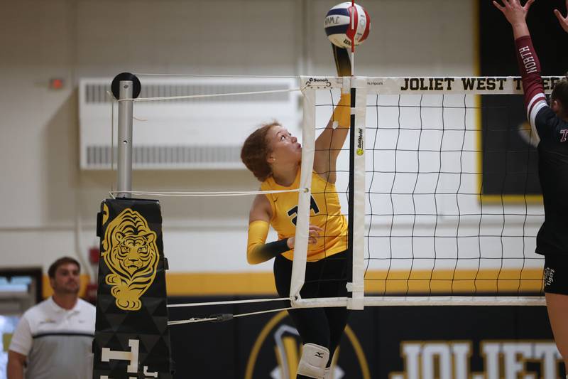 Joliet West’s Natalia Harris hits a shot down the line against Plainfield North on Wednesday, Sept. 6, 2023 in Joliet.