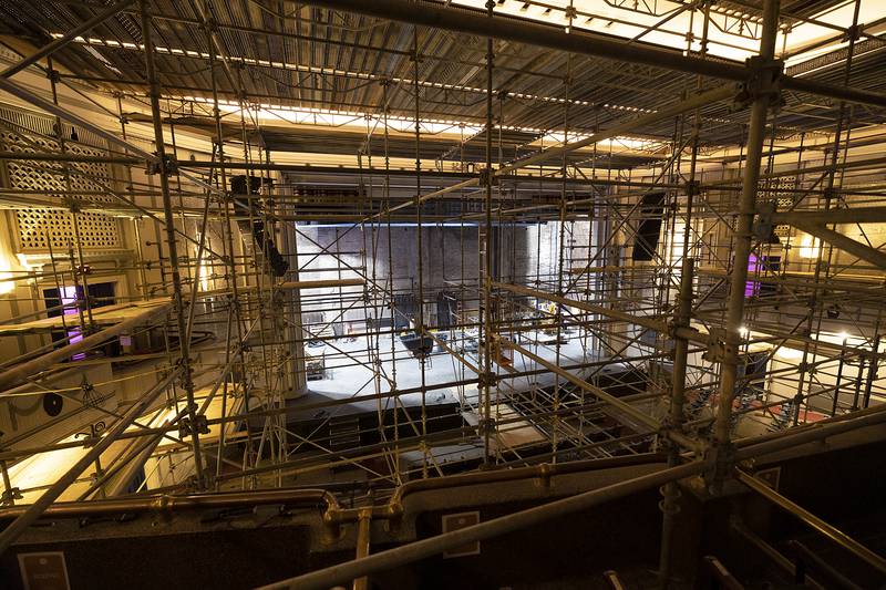 A network of scaffolding criss-crosses the seating area at The Dixon: Historic Theatre on Monday, Nov. 25, 2024. Plaster and painting work is scheduled inside while the roof is being replaced outside.