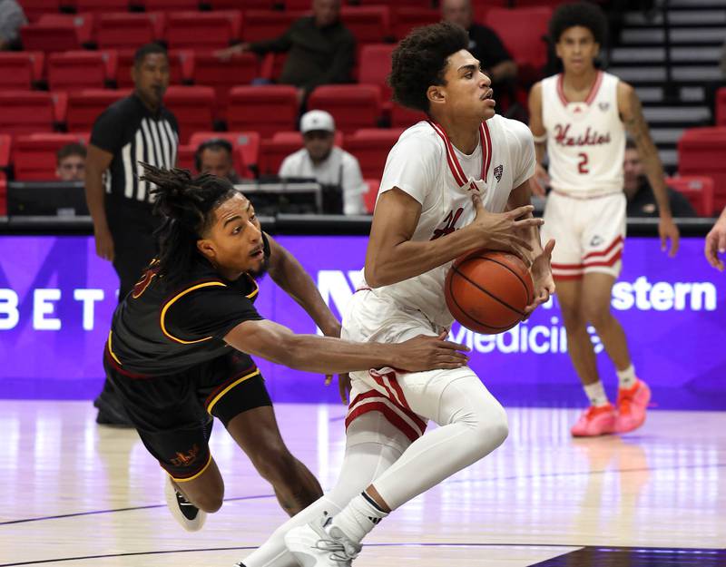 Northern Illinois' forward Ladji Kante gets by Louisiana-Monroe's guard Krystian Lewis Monday, Nov. 3, 2025, during their game at the Convocation Center at NIU in DeKalb.