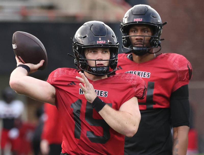 Northern Illinois University quarterback Ean Hamric throws a pass Tuesday, April 14, 2026, during a drill at spring practice in Huskie Stadium at NIU in DeKalb.