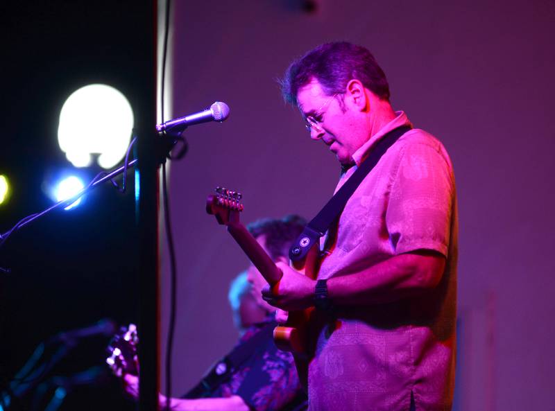 One of the members of Heartache Tonight, an Eagles tribute band, plays the guitar at the Jamboree Concert Series in Mt. Morris on Friday, Aug. 22, 2025.