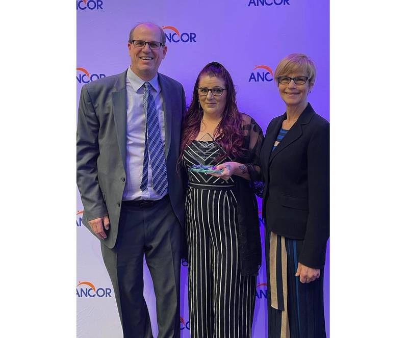 On April 26, the American Network of Community Options and Resources (ANCOR) presented the award to Charlene Vece, who came to Trinity Services in 2006. Pictured is Thane A. Dykstra, president and CEO of Trinity Services; Charlene Vece, Trinity Services; and Barbara Merrill, ANCOR CEO.