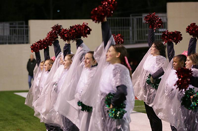 L-P cheerleaders cheer in the rain on Friday, Oct. 14, 2022 at Howard Fellows Stadium in Peru.