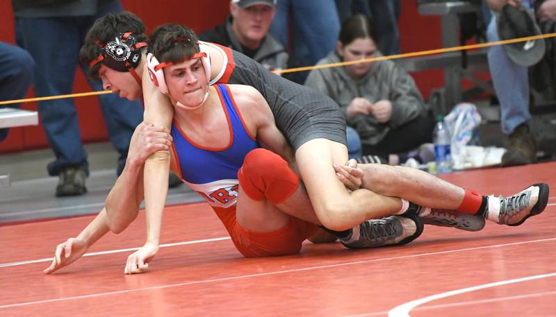 Oregon's Lane Halverson tries to break a hold by Woodstock Marian's Nick Davidson during their 138-pound match at the 1A Oregon Wrestling Sectional on Friday night.