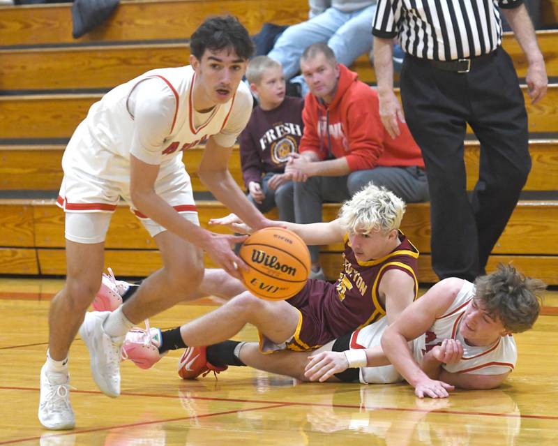 Oregon's Benny Olalde (1) looks up court after Cooper Johnson (2) and Stockton's Ben Hively (15) dive for a loose ball  on Saturday, Dec. 13 at the 64th Annual Forreston Holiday Basketball Tournament held at Forreston High School.