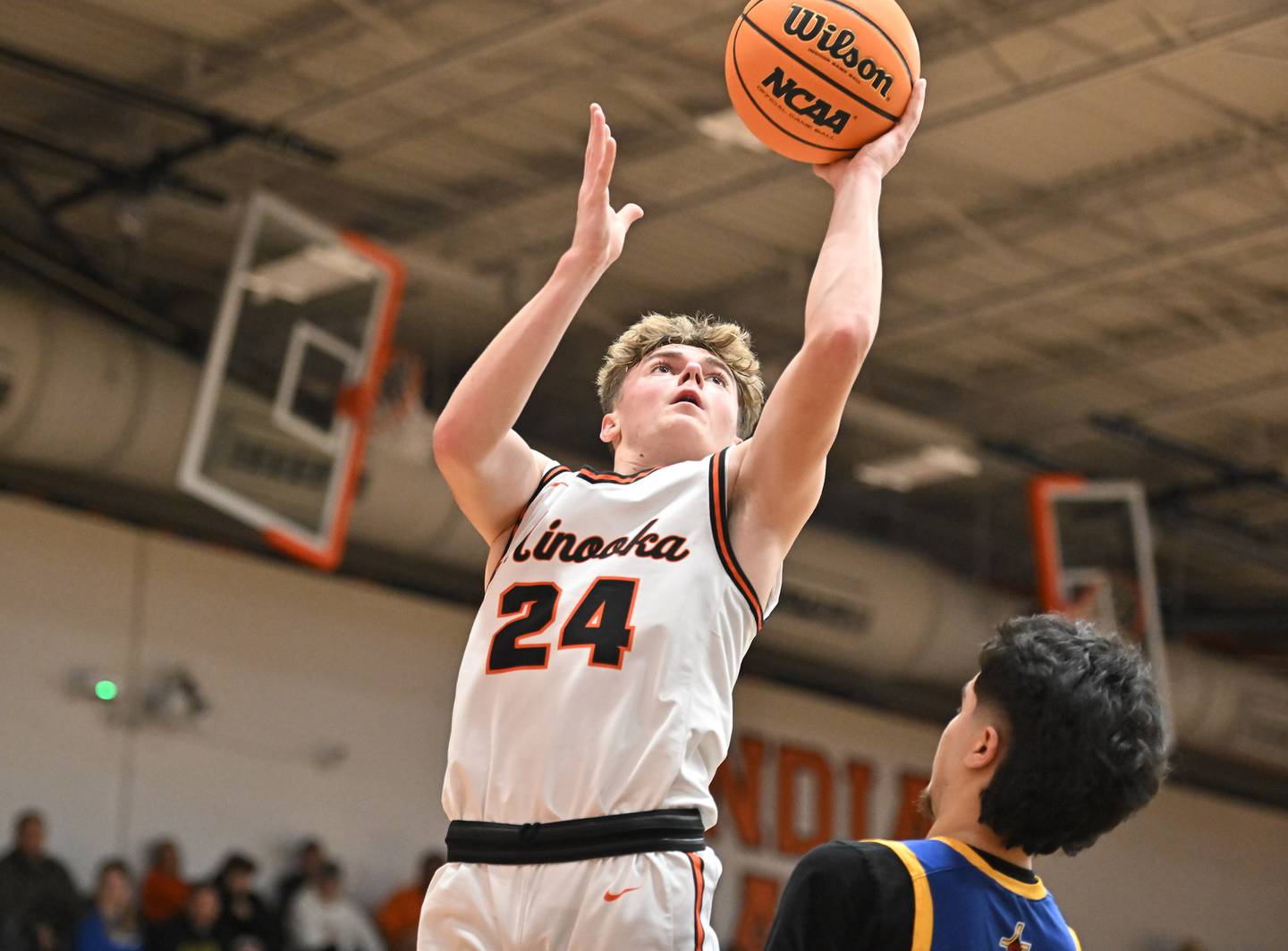 Minooka's Brady Hairald (24) goes up strong for a basket during a conference game against Joliet Central on Friday, Jan. 10, 2025, at Minooka.