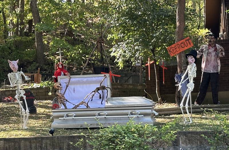 A view of Halloween decorations and a real coffin on the corner of Center Place and Park Place streets on Thursday, Oct. 17, 2024 in Peru.